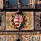 Architectural photograph - coat of arms under the dome of the central projection on the main facade, Museum of Applied Arts