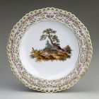 Ornamental plate - decorated with pierced rim and inside with boars