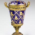 Ornamental vessel with lid