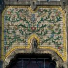 Architectural photograph - ceramic decoration between the first and second floor windows on the main facade, Museum of Applied Arts