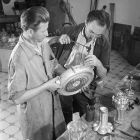 Photograph - László Dömötör and István Ungi restoring the so called Matthias pilgrim bottle from the Esterházy treasury in the Museum of Applied Arts