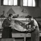 Photograph - István Ungi and Joachim Szvetnik restorers in the goldsmith's  restorer's workshop of the Museum of Applied Arts, at restoration of the platter of"Vezekény"