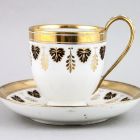 Cup and saucer - Decorated with black and gold leaf motifs