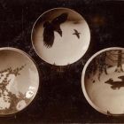 Photograph - Three plates with painted decoration: flowers, ravens, deer