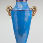 Ornamental vessel with lid