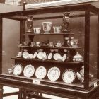 Exhibition photograph - artworks of porcelain of Selma Strasser-Feldau's collection at the exhibition of " Amateur Collectors" of the Museum of Applied Arts 1907 (XIV. vitrine)