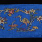 Fragment of embroidery - With flowering branches and crane