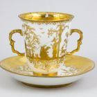 Cup and saucer - with grotesque Chinese figures