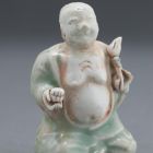 Belt hanging - Seated Budai, holding a lotus and an alms bowl