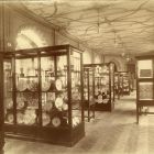 Interior photograph - ceramics of Holics in the permanent exhibition in the gallery of the exhibition hall with ornamental ceiling paintings, Museum of Applied Arts
