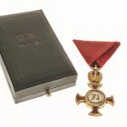 Badge - Crowned Gold Cross of the Francis-Joseph Order on red ribbon