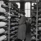 Photograph - Sándorné Borsi textile restorer   in the carpet depot of the Museum of Applied Arts