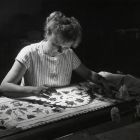 Photograph - Sándorné Borsi textile restorer at restoration the sheet edge with aristocratic embroidery in the textile's workshop of the Museum of Applied Arts