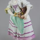 Statuette - shepherdess playing a hurdy-gurdy