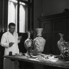 Photograph - restorer Imre Nyíri during the restoration of Italian majolica vases to the ceramic restorer's workshop of the Museum of Applied Arts