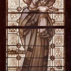 Photograph - stained glass window with Virgin Mary in the chapel of the Roman Catholic Church of Zebegény